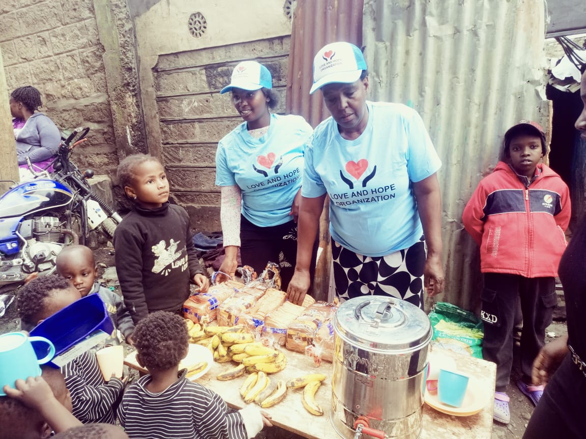 LoveHope volunteers with community members